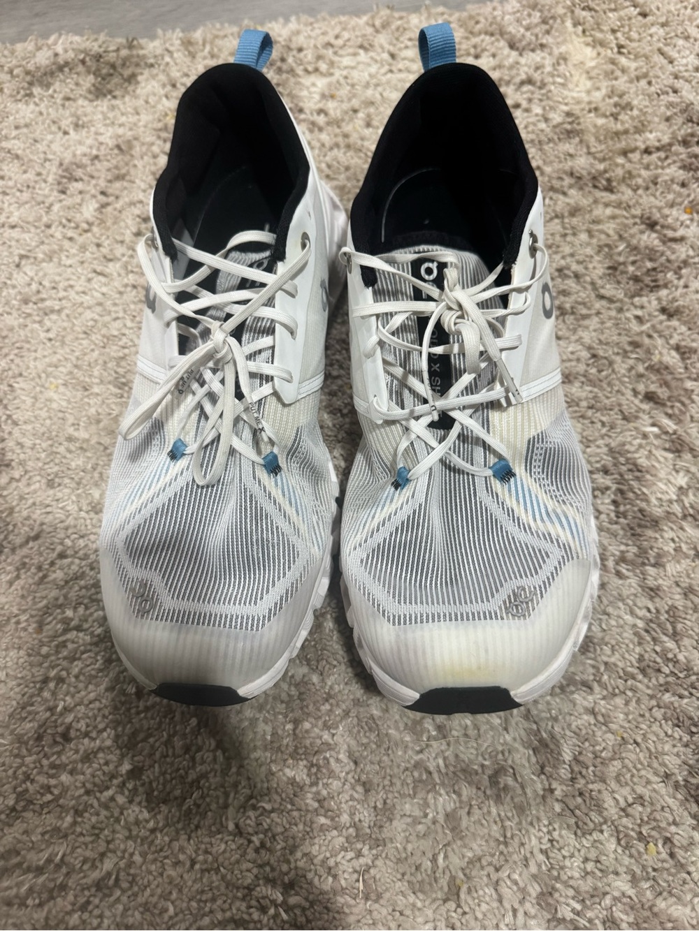 On Running Men’s White Athletic Shoes with Light Blue Accents